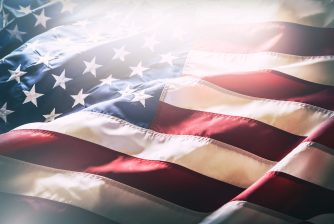 USA flag. American flag. American flag blowing wind. Close-up. Studio shot.